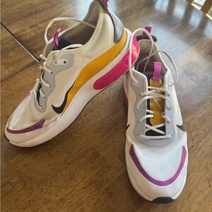 Nike Women's White Sneakers with Pink and Yellow Accents